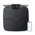 Black eight-electrode intelligent body fat and health monitoring scale on a floor.