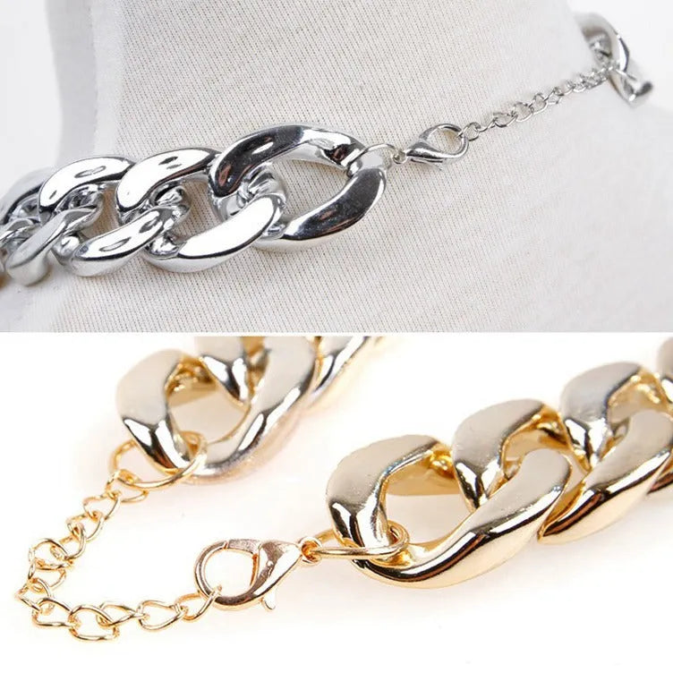 Gold colour twisted chain dog collar with buckle fastener on a white background.