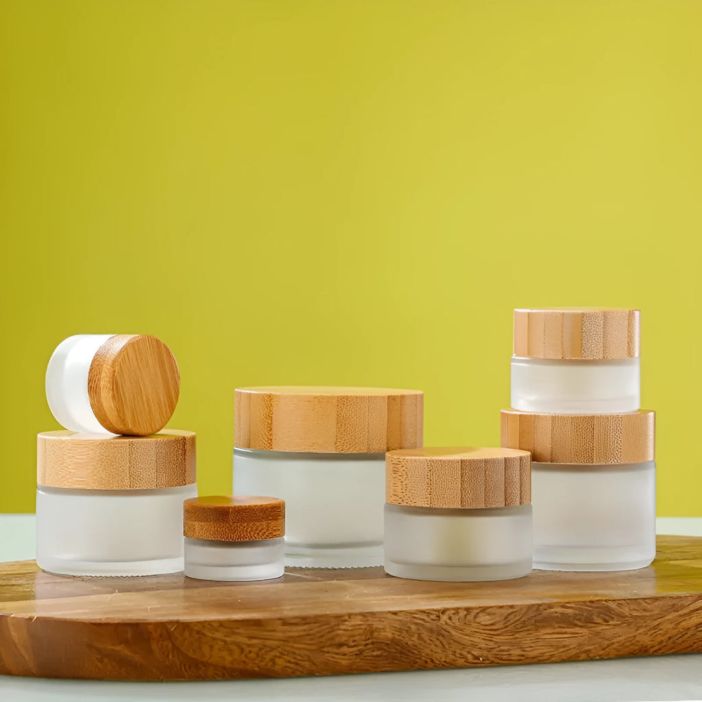 Bamboo wood cover frosted glass cream bottle with inner cushion, shown in transparent and frosted, 50g 60g 100g.