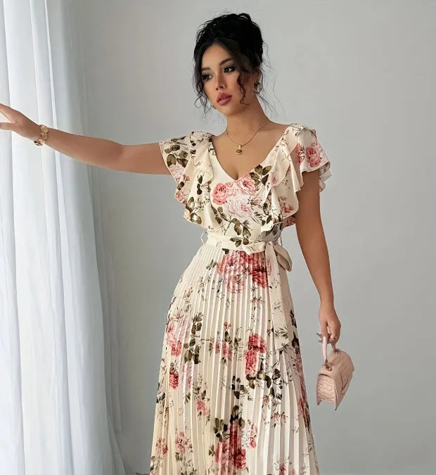 Apricot-coloured women's V-neck dress with a digital floral print, ruffled short sleeves, and a flowing oversized swing skirt.