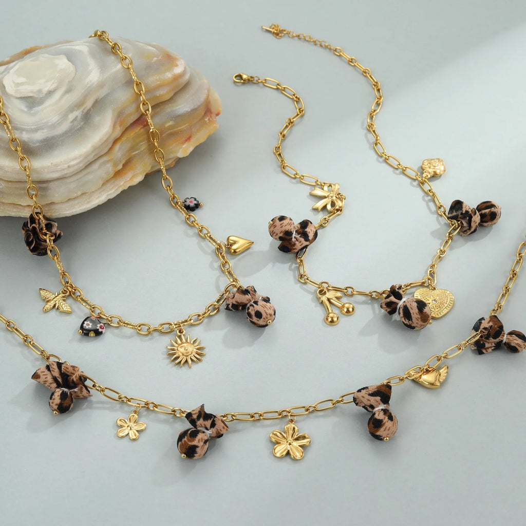Stainless steel necklace with geometric leopard pendant featuring love heart flowers