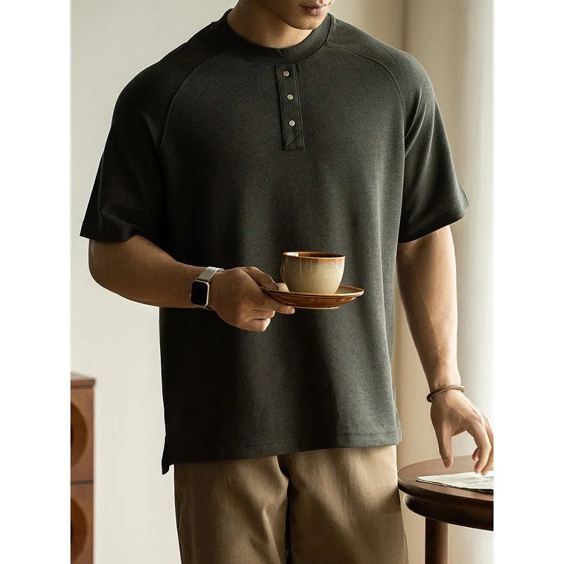 Women's loose grey casual top with raglan sleeves and a terry texture fabric.