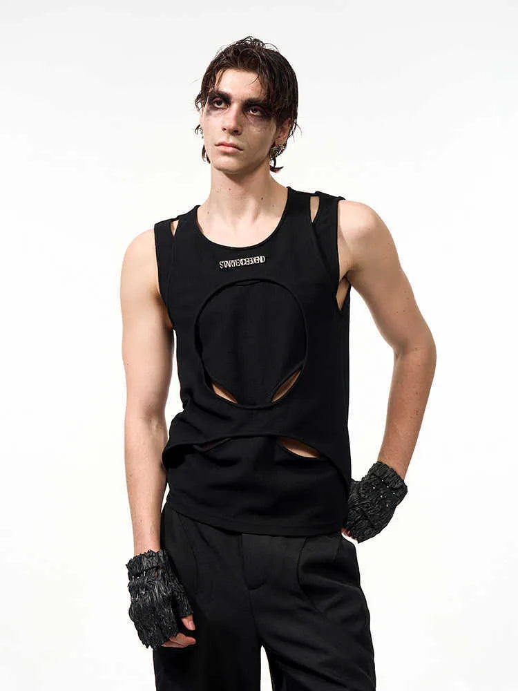 Man wearing a loose-fitting white sleeveless hollow-out thread waistcoat with a round neck.