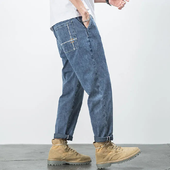 Men's loose fit plus size jeans with elastic mid waist, thin cotton denim, blue or black, sizes L to 7XL