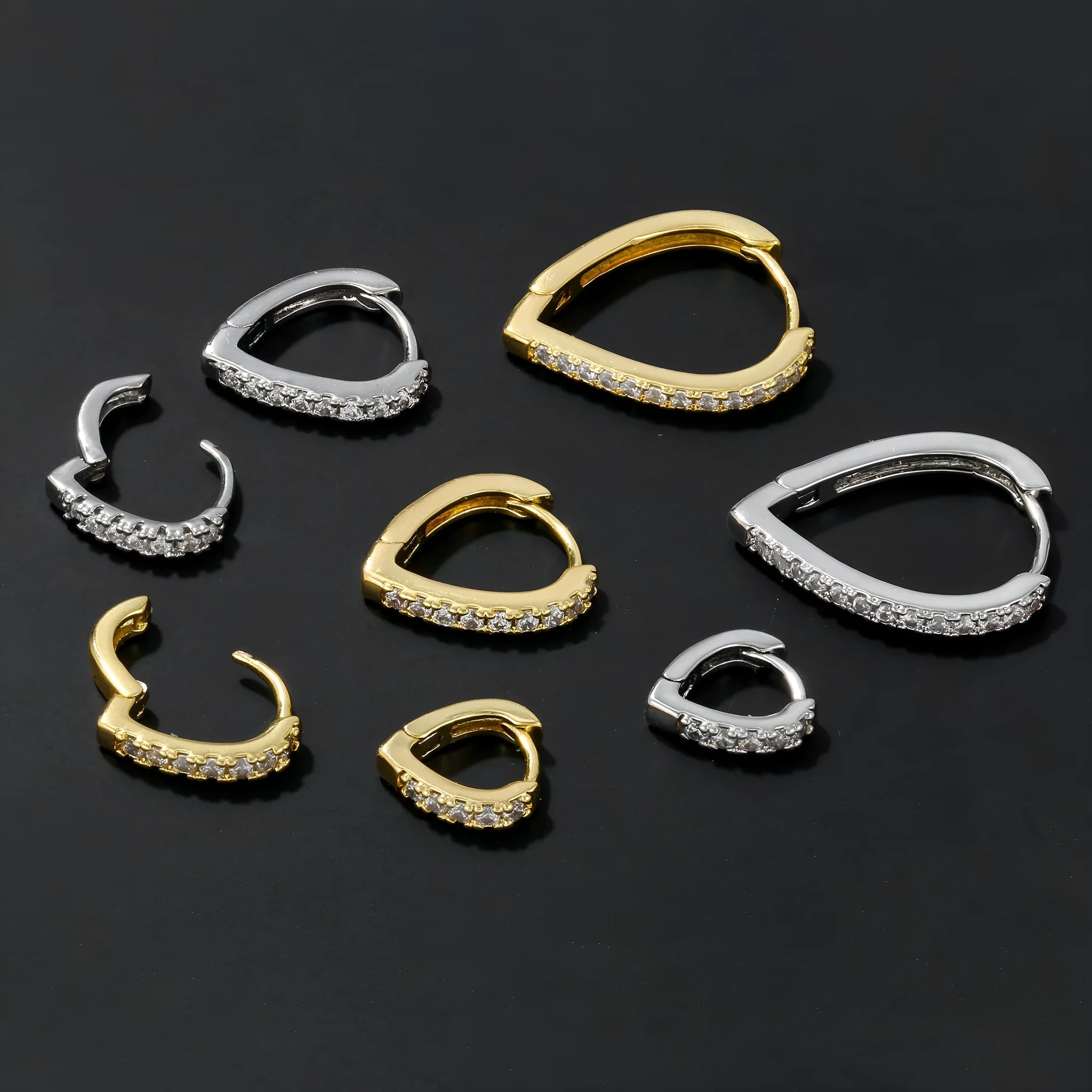 Geometric heart-shaped ear clips in gold and white colours on copper with clip back