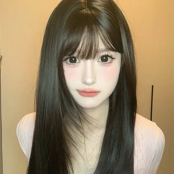 Dark brown synthetic long straight wig with bangs on wig head