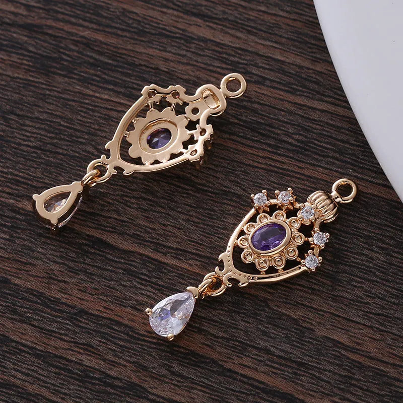 Copper crown water drop pendant with micro inlaid zircon detail in five colour options on white background