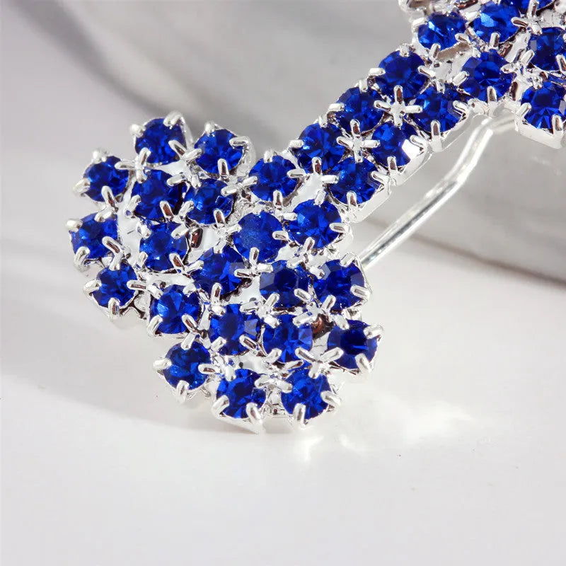 Dog bone pet barrette in size S with diamond accent, shown in white, pink, blue, and red colour options