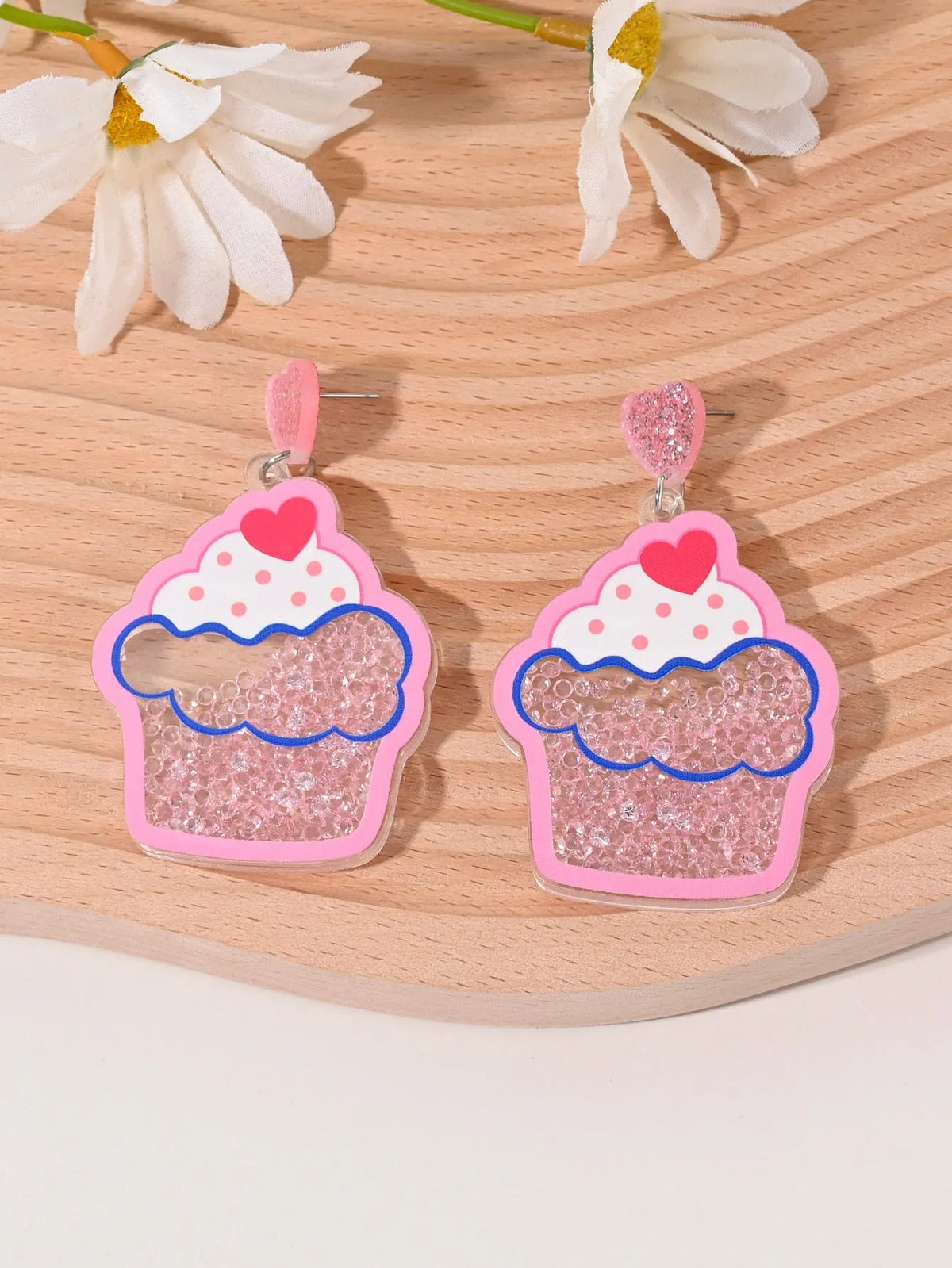 Acrylic drop earrings shaped like a strawberry, cherry, watermelon, pineapple, cake, ice cream, and coconut tree on a white background.