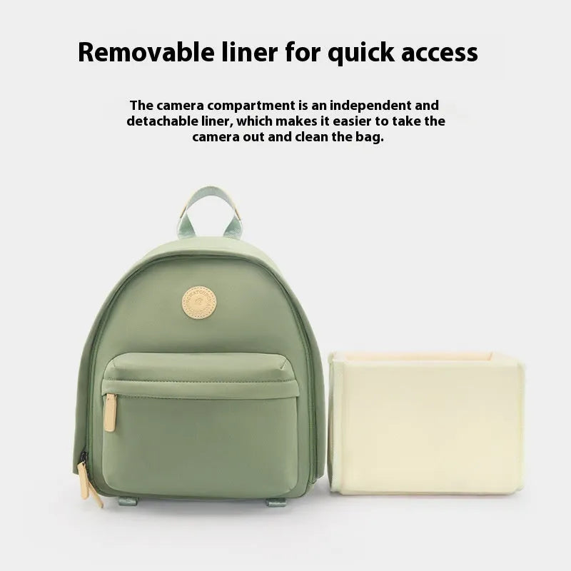 Green polyester shoulder camera bag for women with a detachable iPad compartment on a curve belt.