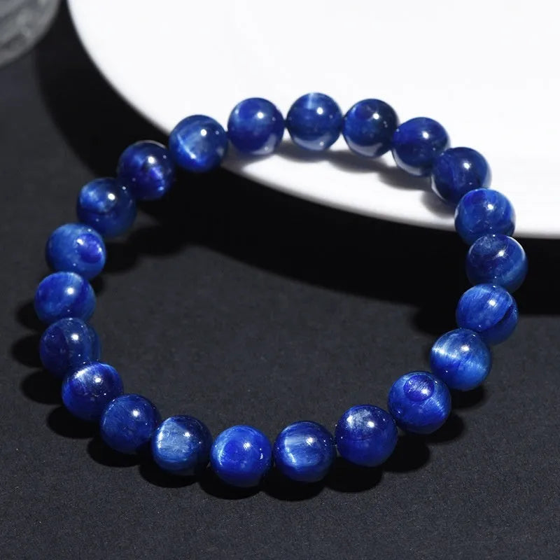 Blue crystal ball bracelet with geometric beads and Ruyi design elements on wrist