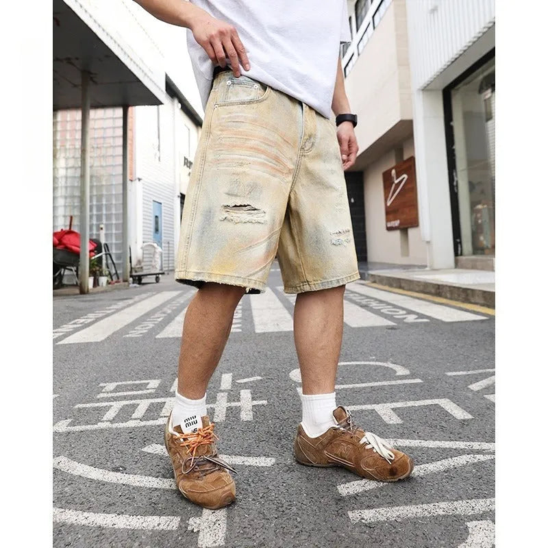 Light blue distressed denim shorts for men with straight-leg cut and mid-waist fit