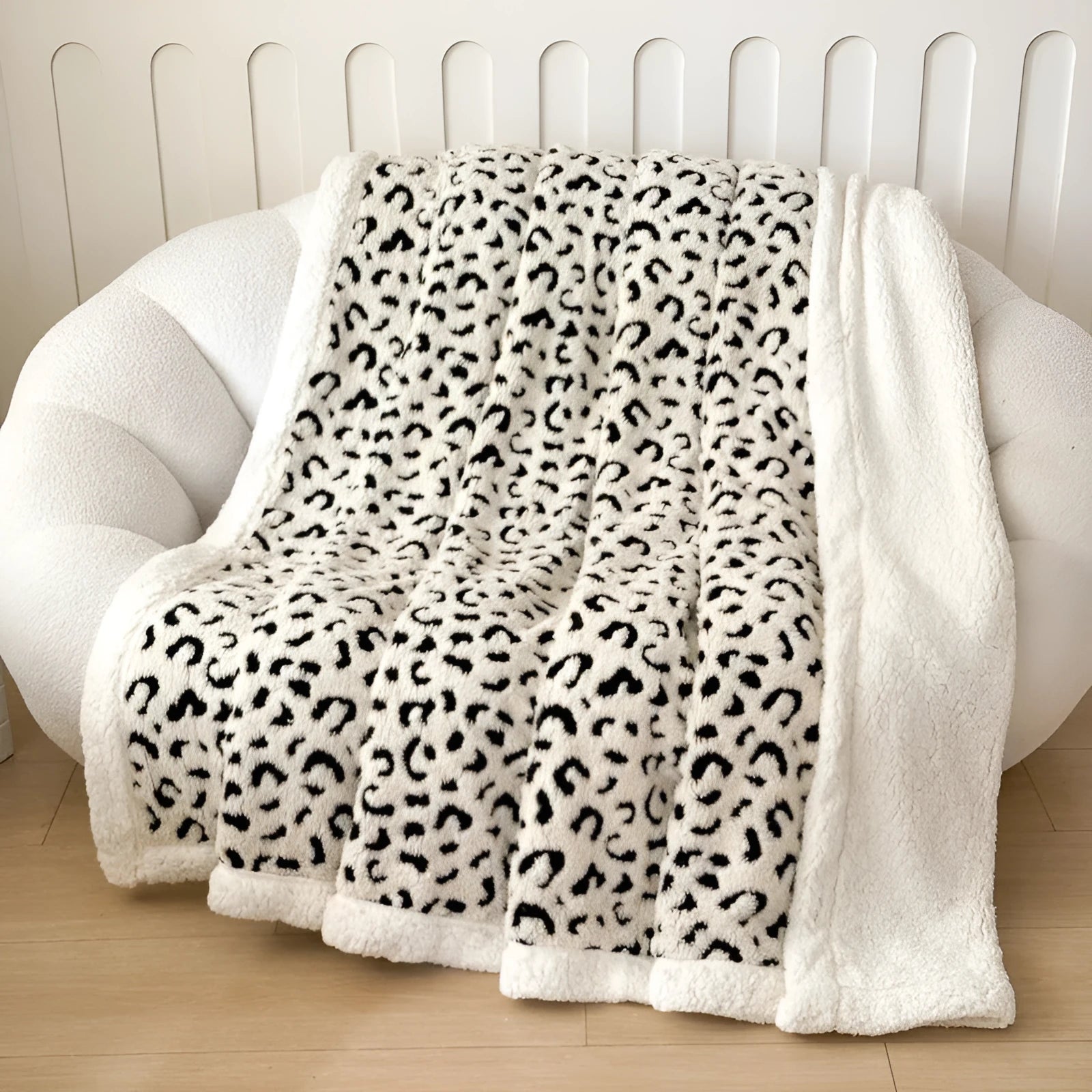 Double-layer taffeta blanket with reversible leopard jacquard print design shown in camel colour