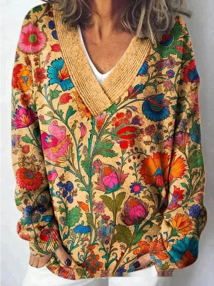 Women's grey V-neck sweatshirt with a white 3D floral pattern print and long sleeves.