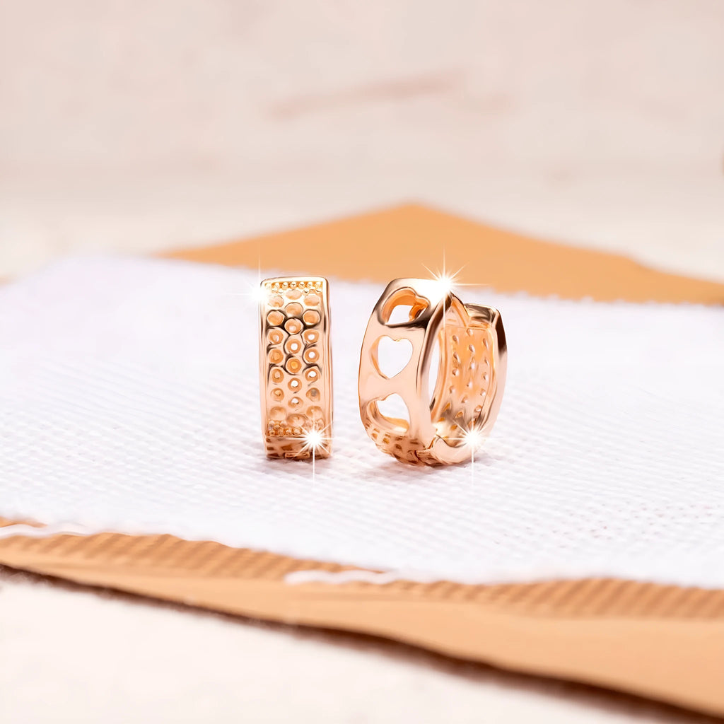 Rose gold electroplated women's earrings with hollowed-out heart design inside circular frame