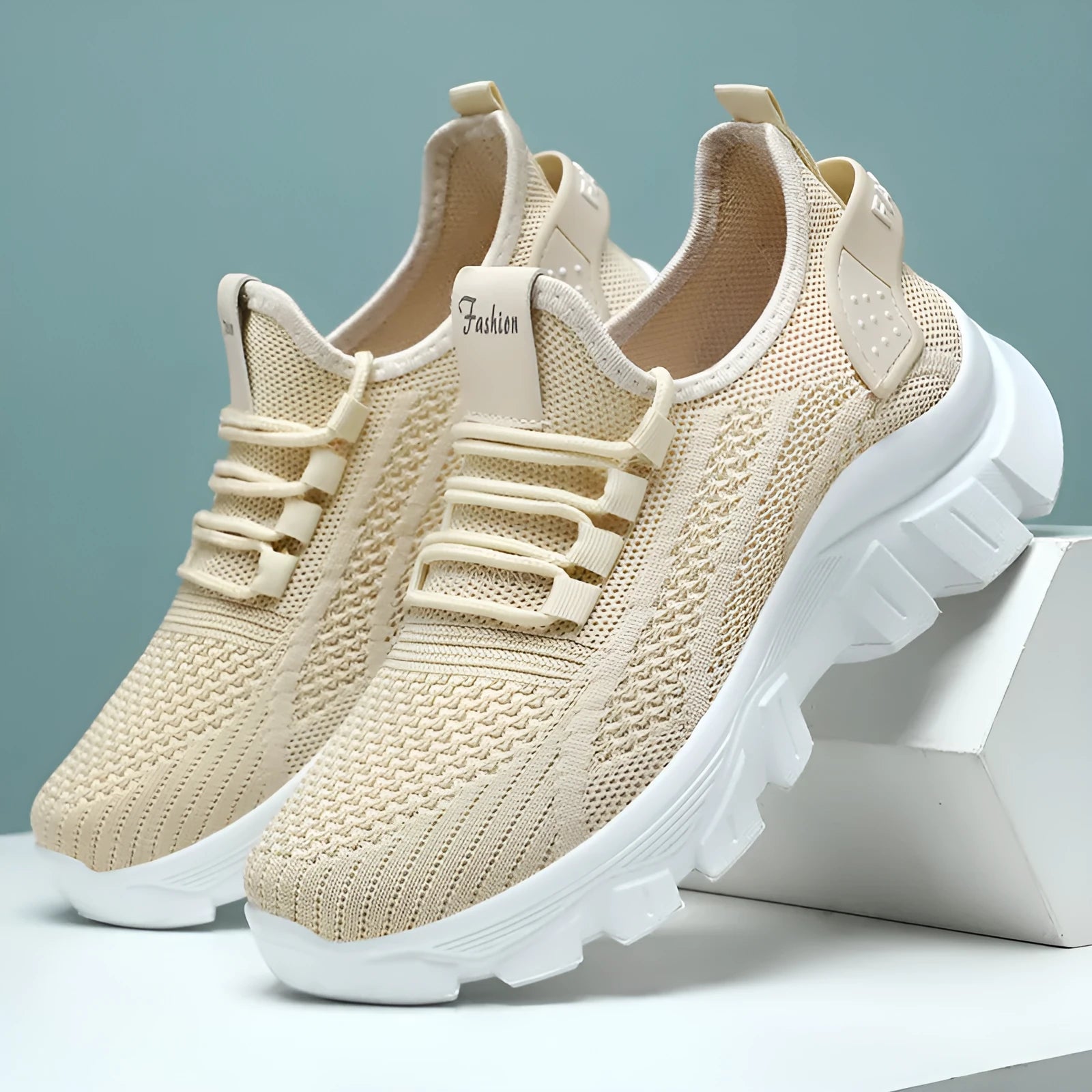 Women's white flyknit running sneaker with thick PVC sole and lace-up front