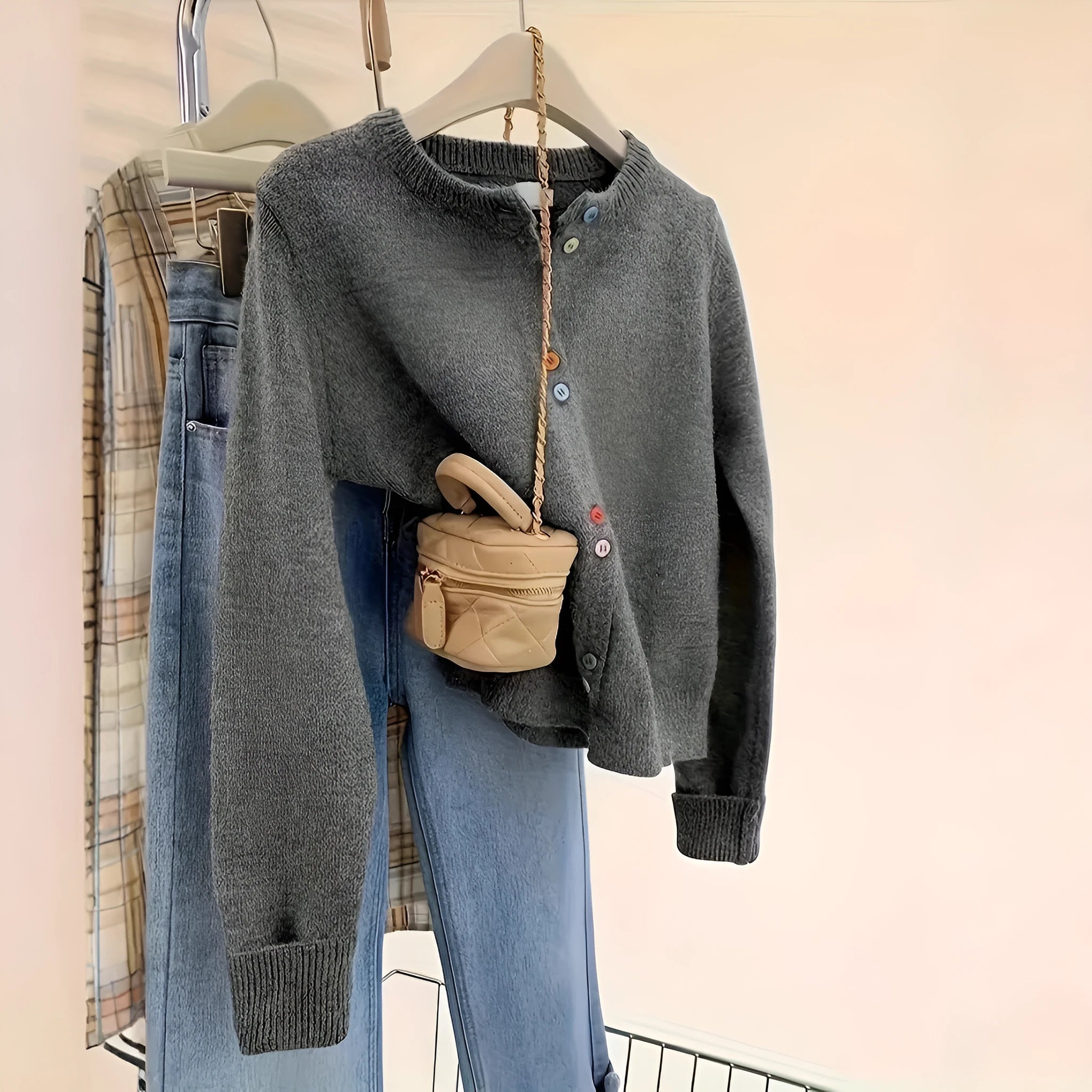 Dark grey women's polyester cardigan with long sleeves and button front.