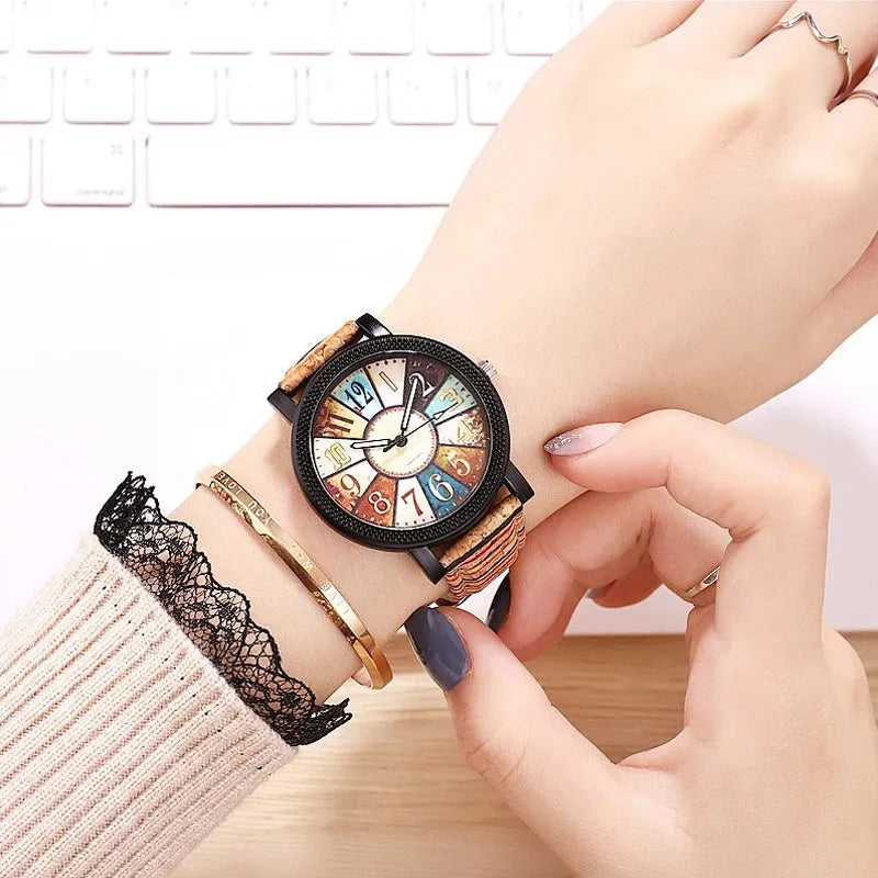 Women's leather strap quartz watch with 37mm round dial and stainless steel buckle