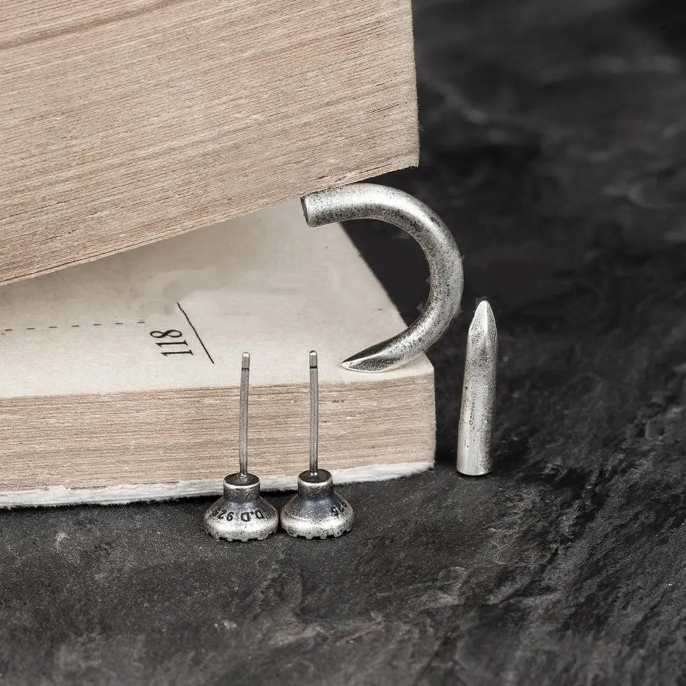 S925 sterling silver punk nail stud earring on an ear hook, showing straight and curved style options.