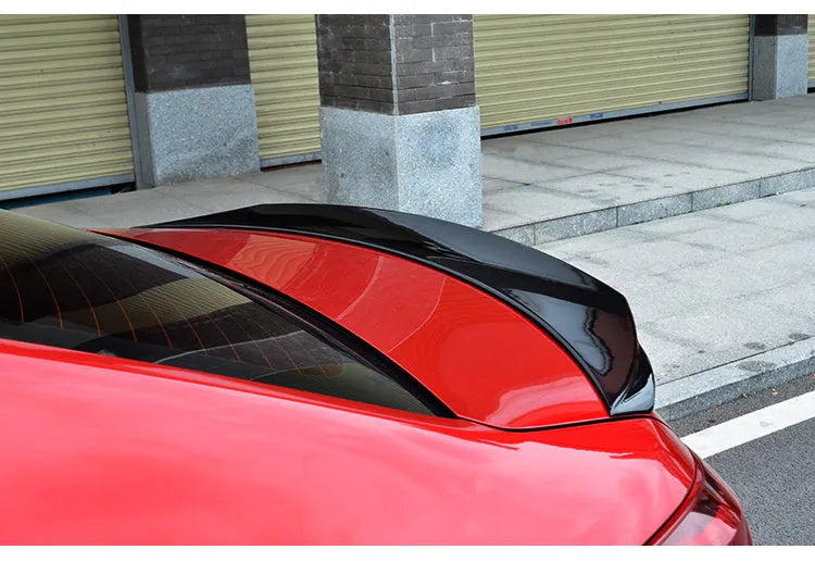 Bright black Mazda 3 modified tail trim for 2014-2021 Axela Exela models with large fixed wind surrounded design