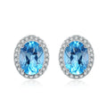 925 sterling silver jewellery set with blue topaz gemstones showing earrings, ring, pendant and necklace