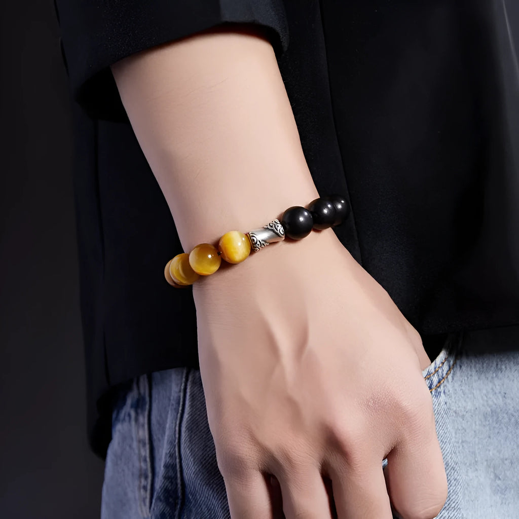 Men's handmade obsidian bracelet with sterling silver accents, Mountain and Sea Fearless design