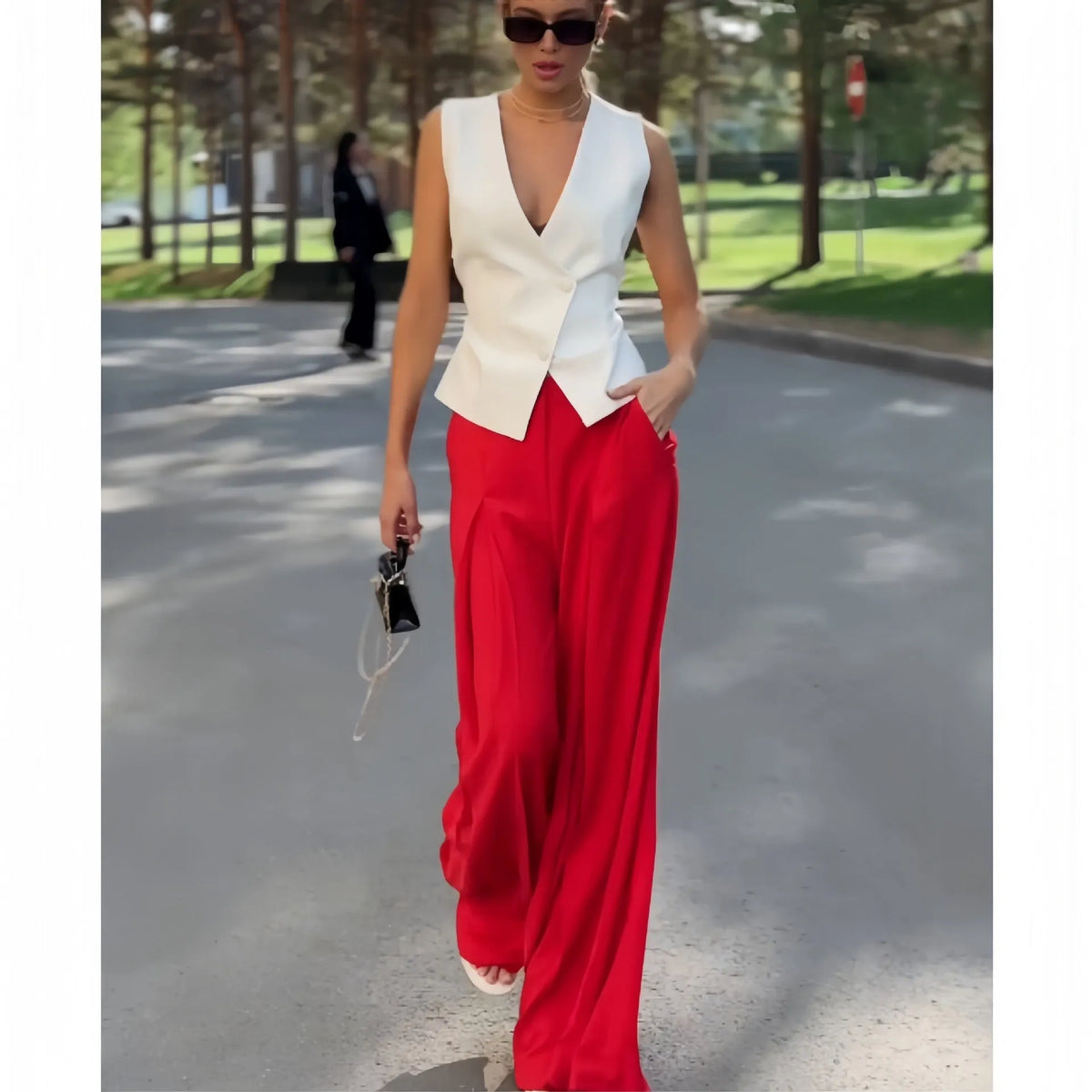 Women's beige polyester two-piece set with sleeveless deep V-neck top and wide-leg trousers