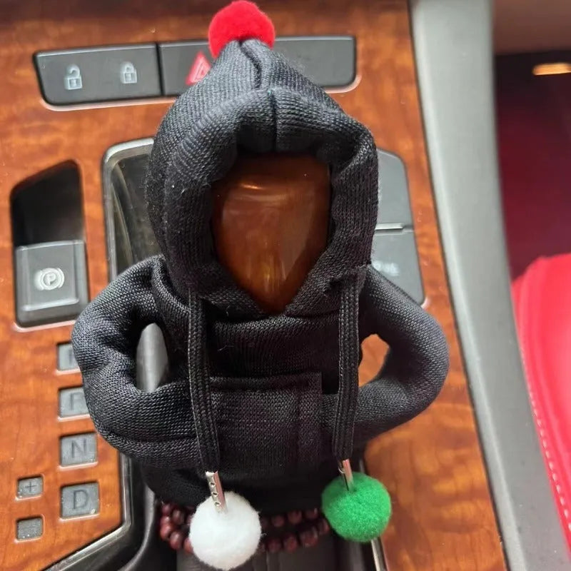 Santa Claus car gear lever cover in black or pink fabric with hooded sweatshirt design, fitting gear shift knob and handbrake.