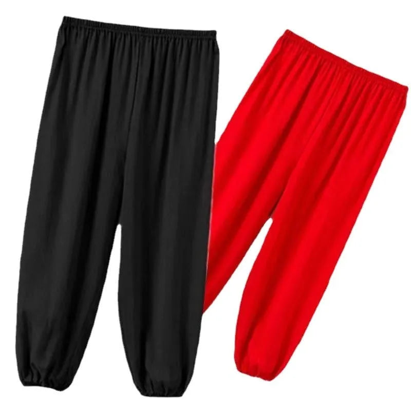Children's high elasticity martial arts practice trousers in black, shown in a front view.