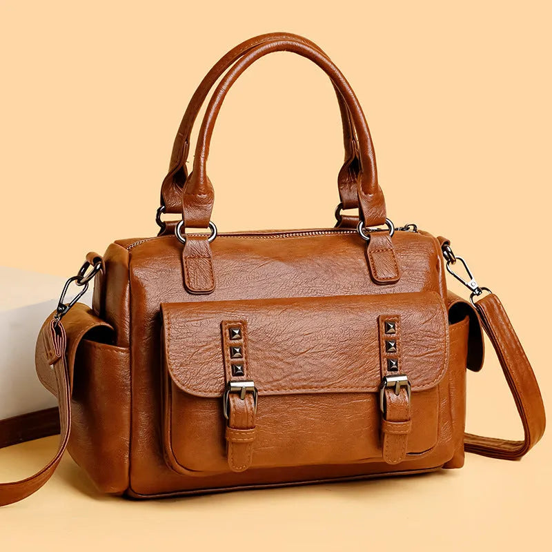 Vintage style large capacity square messenger bag in PU leather with contrast stitching.