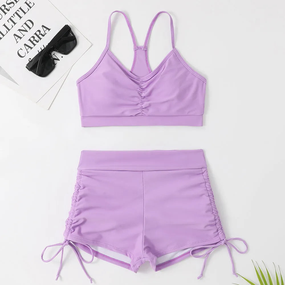 Women's purple high waist split bikini swimsuit with lining, showing top and shorts.