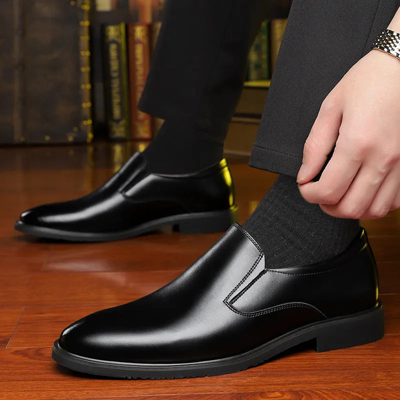 Men's black business casual slip-on shoes with leather uppers and rubber soles