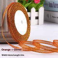 Polyester ribbon roll in various colours including gold leaf and silver, showing 0.6cm width and 22 metre length