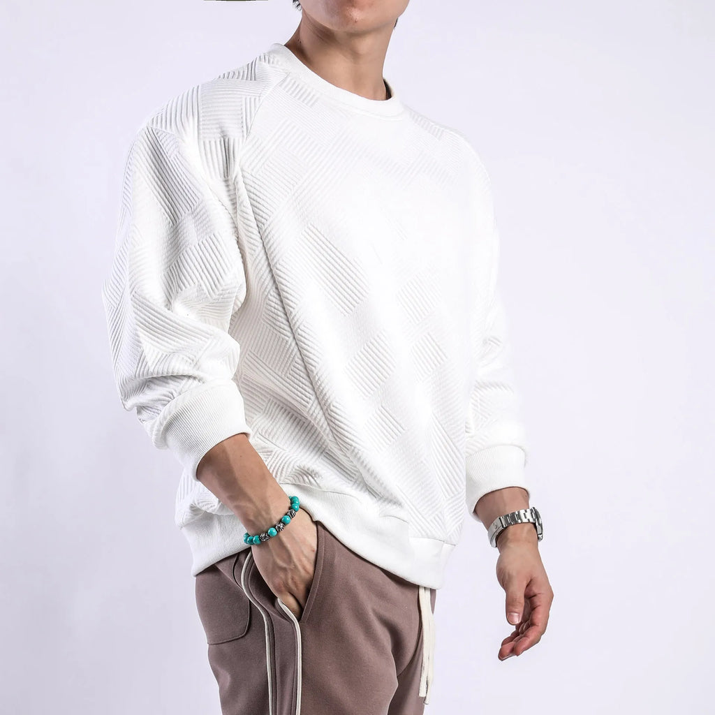 Men's loose fit twill Jacquard pullover sweater in army green, shown on a model.