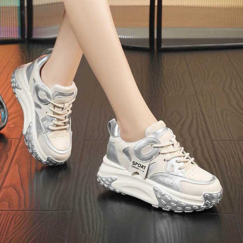 A pair of leather casual shoes with a thick wedge sole and round toe in a lace-up design.
