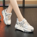 A pair of leather casual shoes with a thick wedge sole and round toe in a lace-up design.