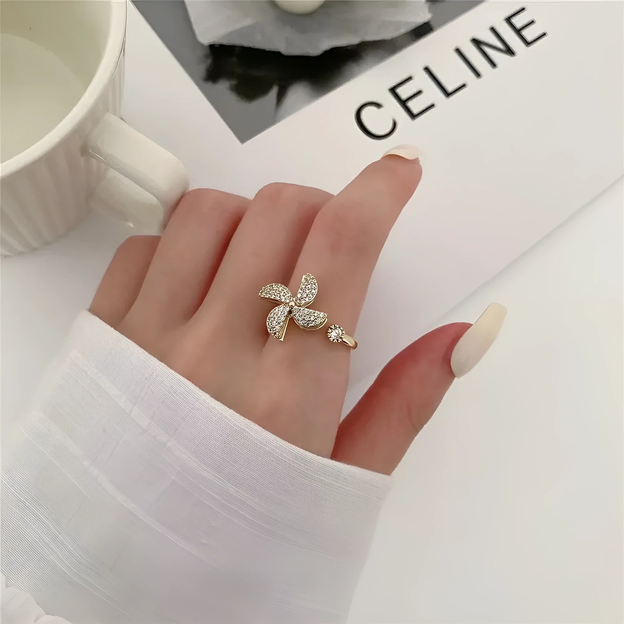 Rotating ring with spinning windmill design and micro inlaid geometry pattern in gold electroplated finish