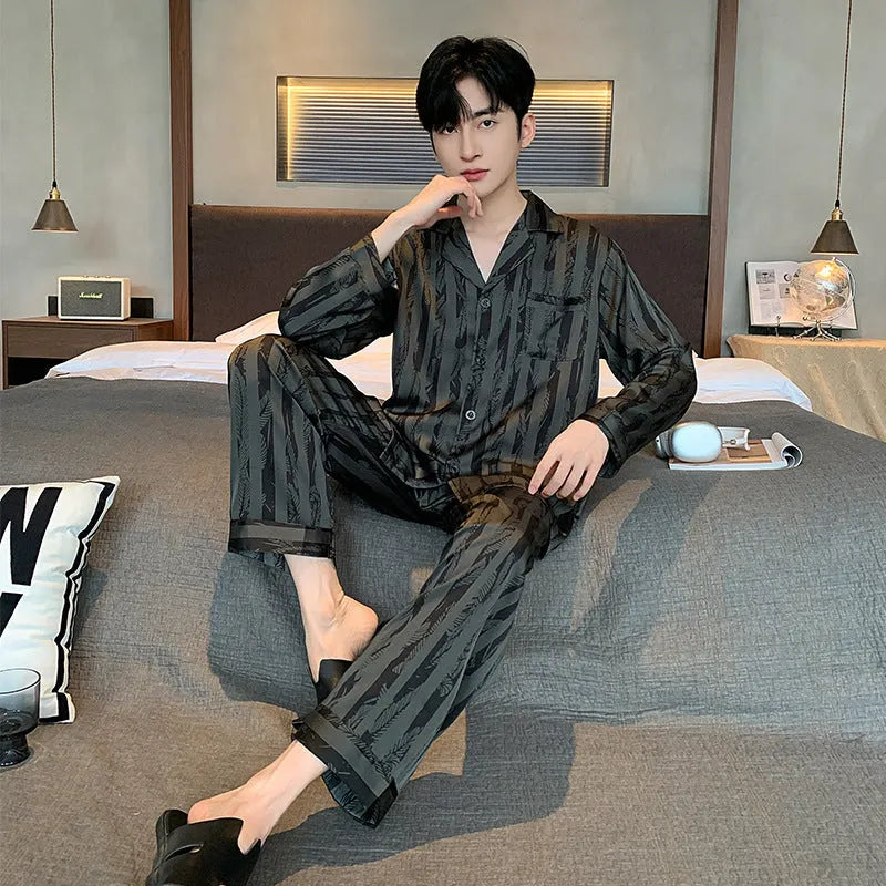 Black striped men's ice silk two-piece pajama set with V-neck top and long trousers.