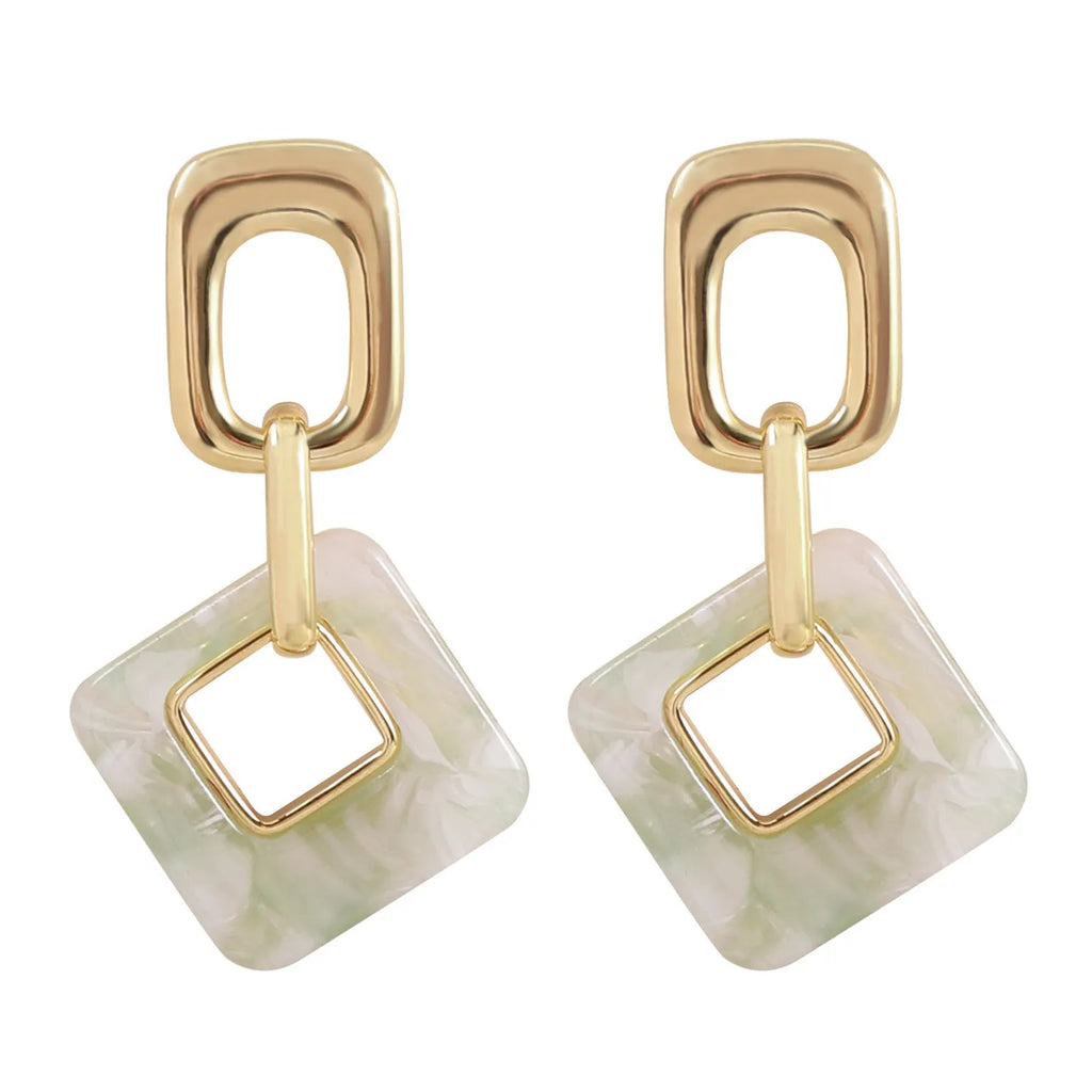 Copper geometric square earrings with hollow design and chamfered corners in metallic finish