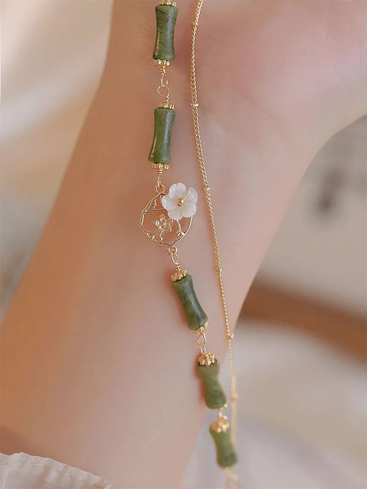 Natural olivine double layer bracelet with twin Bells of Ireland charms and olive branch design elements