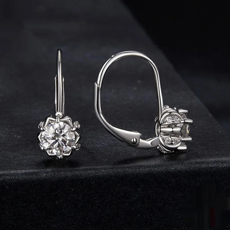 Sterling silver flower bud clip earrings with white gold plating and 0.5 carat moissanite stone