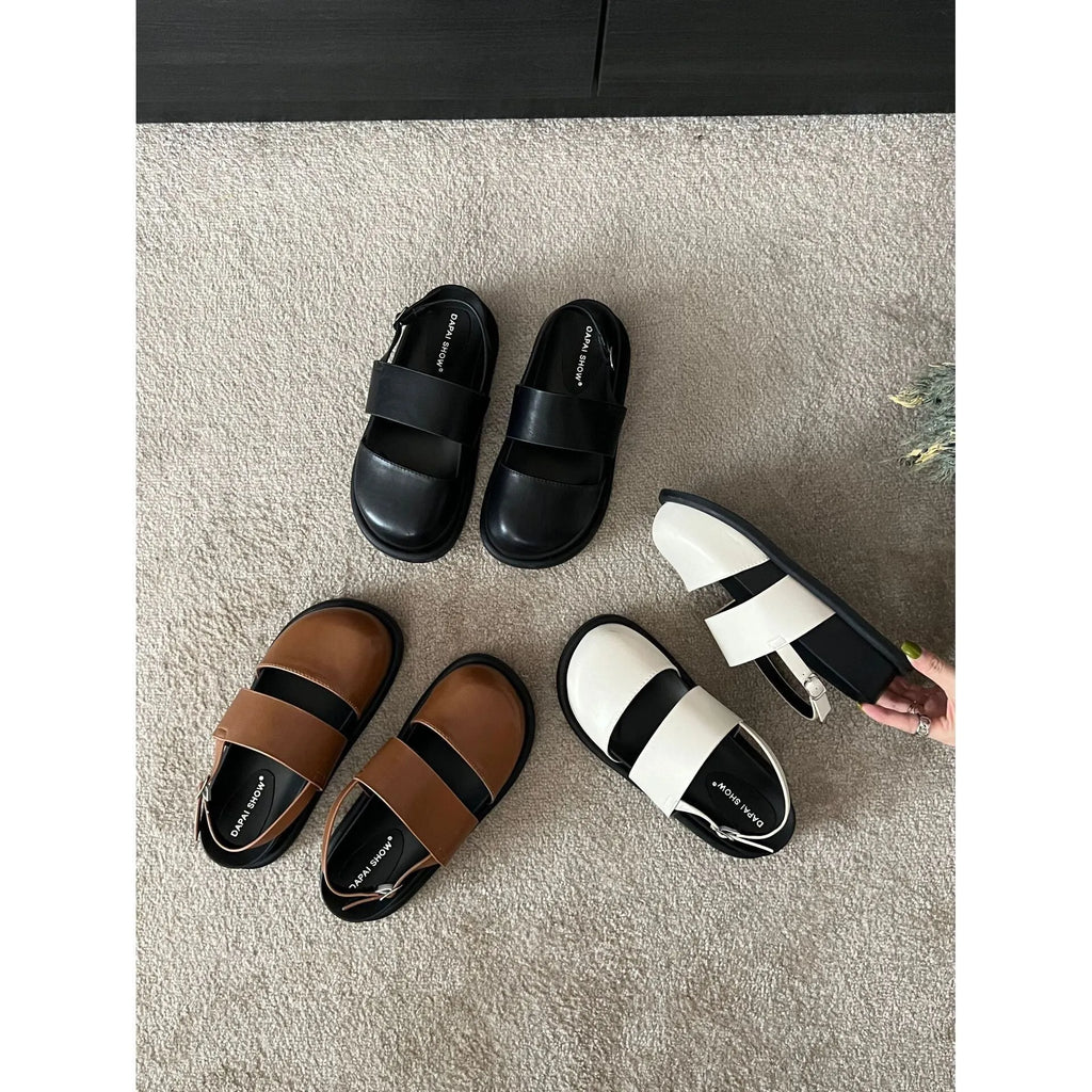 Retro closed-toe sandals with an adjustable ankle strap buckle in black, brown, or apricot colour.