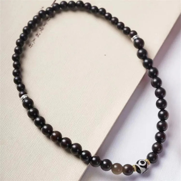 Ebony wood bracelet with 8mm diameter and two circles of beads in retro style