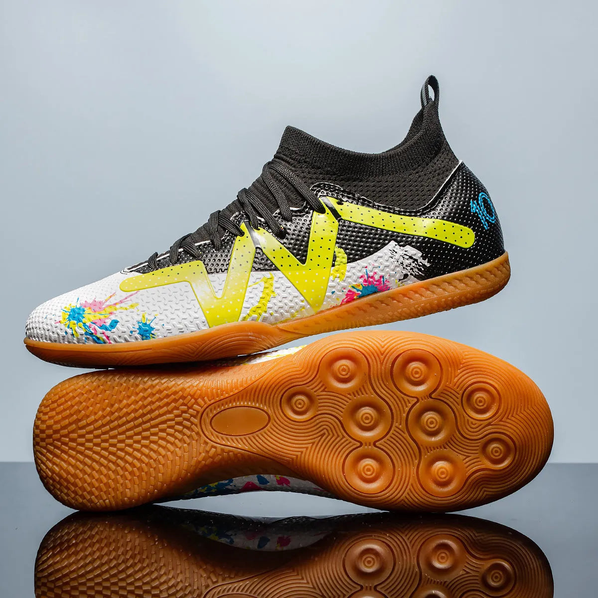 Low-top adult football boots with replaceable screw-in studs on a non-slip rubber sole.