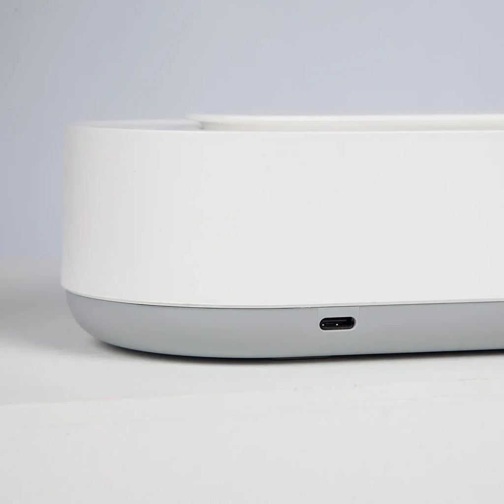 White portable ultrasonic cleaning machine with display and stainless steel tank.