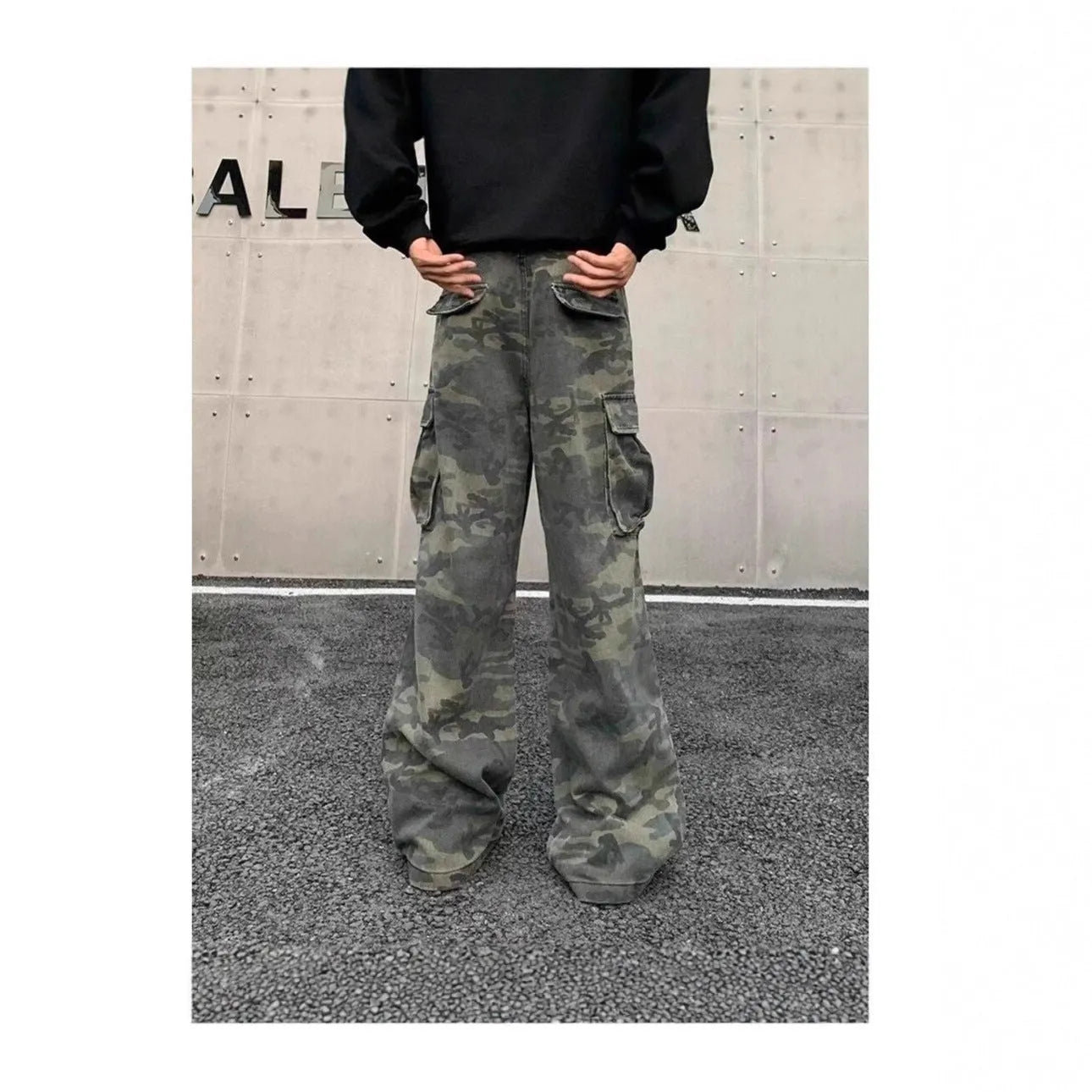 Washed camouflage cargo trousers with multiple pockets on a mid-waist fit.