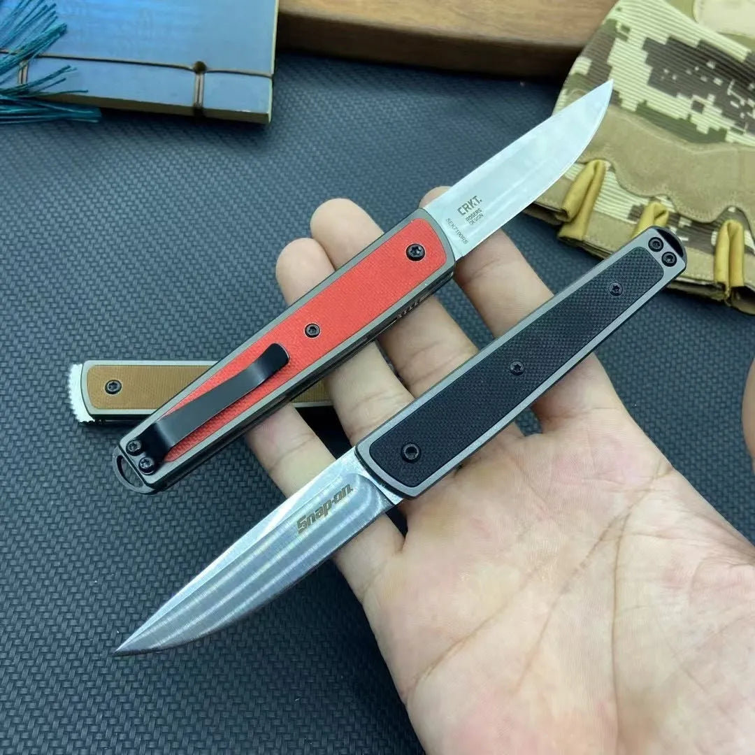 Folding fruit knife with stainless steel blade showing black, coffee colour, and red handle options