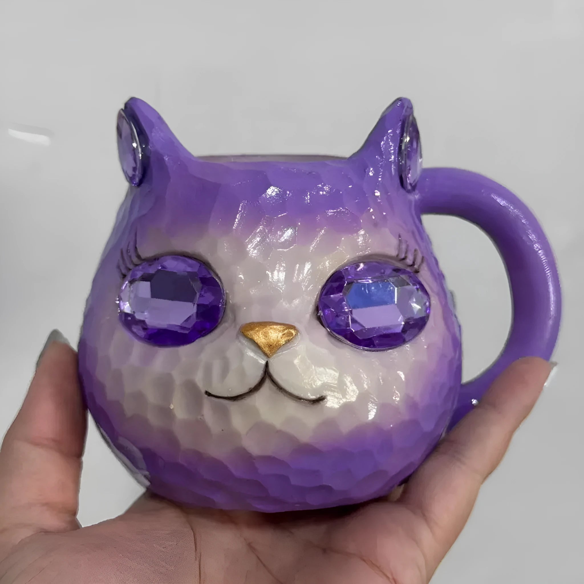 Resin cat cup decorative figurine ornament in purple, green, blue, or pink colour.