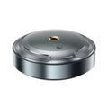 Silver automatic car air freshener diffuser with zinc alloy metal shell on anti-slip pad.