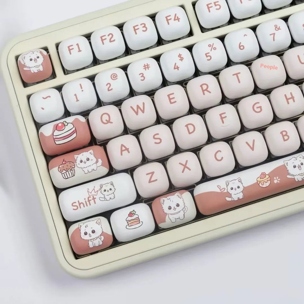 Cartoon dessert cat design on a round MOG profile mechanical keyboard key cap.